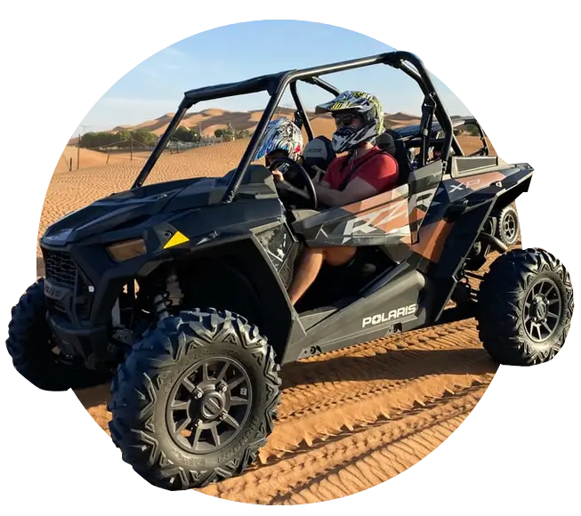 two person using atv car in dessert